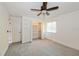 Bright bedroom featuring a ceiling fan, a window with blinds, and access to a closet at 1606 Wildcat Ct, Winter Springs, FL 32708