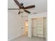 Bedroom with a ceiling fan and a closet with shelving in a home for sale at 1606 Wildcat Ct, Winter Springs, FL 32708