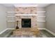 Close-up view of brick fireplace with decorative mantel and built-in shelves at 1606 Wildcat Ct, Winter Springs, FL 32708
