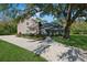 Charming two-story home featuring mature landscaping, a spacious driveway, and a welcoming front entrance at 1606 Wildcat Ct, Winter Springs, FL 32708