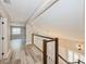 Upstairs hallway with nice banister, lots of natural light, and hardwood floors at 1606 Wildcat Ct, Winter Springs, FL 32708