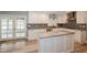 Lovely kitchen with stainless steel appliances, granite countertops, an island, and french doors to the patio at 1606 Wildcat Ct, Winter Springs, FL 32708
