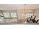 Loft features a staircase, chandelier and windows with shutters at 1606 Wildcat Ct, Winter Springs, FL 32708