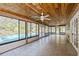 Spacious sunroom featuring a view of a pool and lots of natural light at 1606 Wildcat Ct, Winter Springs, FL 32708