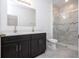 Modern bathroom featuring a double sink vanity and a glass-enclosed shower at 16893 Sw 17Th Ter, Ocala, FL 34473