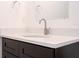 Bathroom with a vanity with a white countertop, dark wood cabinets, a stainless steel faucet, and a mirrored wall cabinet at 16893 Sw 17Th Ter, Ocala, FL 34473