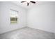 Bedroom featuring neutral paint, tile flooring, and a window providing natural light at 16893 Sw 17Th Ter, Ocala, FL 34473