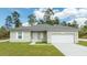 Charming single-story home featuring a well-maintained lawn and an attached two-car garage at 16893 Sw 17Th Ter, Ocala, FL 34473