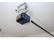 Close up image of a garage door opener mounted to the ceiling at 16893 Sw 17Th Ter, Ocala, FL 34473