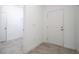 Hallway features tile flooring, neutral paint, and doors at 16893 Sw 17Th Ter, Ocala, FL 34473