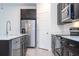 Stylish kitchen with stainless steel appliances, dark cabinets, and bright countertops at 16893 Sw 17Th Ter, Ocala, FL 34473