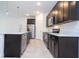 Well-lit kitchen with stainless steel appliances, an island, and modern fixtures at 16893 Sw 17Th Ter, Ocala, FL 34473