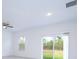 Bright living room with large sliding glass doors and a ceiling fan at 16893 Sw 17Th Ter, Ocala, FL 34473