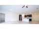 Open-concept living area with kitchen featuring stainless appliances and a center island with pendant lights at 16893 Sw 17Th Ter, Ocala, FL 34473