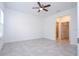 Spacious main bedroom with a ceiling fan and a view into the ensuite bathroom and walk-in closet at 16893 Sw 17Th Ter, Ocala, FL 34473