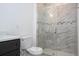Modern bathroom featuring a glass-enclosed shower with marble tile at 16893 Sw 17Th Ter, Ocala, FL 34473