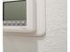 Close up of a ProSeries thermostat mounted on a textured interior wall at 16893 Sw 17Th Ter, Ocala, FL 34473