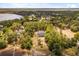 Lakeside community showcasing stunning homes with private docks and lush landscaping from an aerial view at 19715 Eaglesview Cir, Umatilla, FL 32784