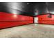 Spacious unfinished basement with dark ceiling, adaptable for various uses and customization at 19715 Eaglesview Cir, Umatilla, FL 32784