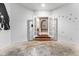 Entryway with decorative butterflies, arched doorways, and wood flooring at 19715 Eaglesview Cir, Umatilla, FL 32784