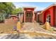 Inviting brick home showcasing a grand stone pathway, archway entrance, and lush surroundings at 19715 Eaglesview Cir, Umatilla, FL 32784