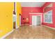Bright living room with tiled floors, bright walls, closet and large window at 19715 Eaglesview Cir, Umatilla, FL 32784