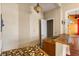 Wet bar with mosaic countertops and pendant lighting, adjacent to an archway at 19715 Eaglesview Cir, Umatilla, FL 32784