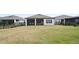 Spacious backyard with lush green lawn and black metal fence for privacy and security, great for outdoor activities at 2116 Limestone Trl, Kissimmee, FL 34747