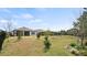 Well-maintained backyard with metal fence and green lawn offering space and privacy, ideal for Gathering enjoyment at 2116 Limestone Trl, Kissimmee, FL 34747