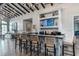 Stylish community bar area with decorative backsplash, bar seating, and overhead lighting at 2116 Limestone Trl, Kissimmee, FL 34747