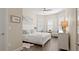 Bright bedroom with natural light, a ceiling fan, wood flooring, and plantation shutters at 2116 Limestone Trl, Kissimmee, FL 34747