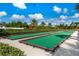 Bocce ball court surrounded by lush landscaping and greenery, offering a tranquil setting at 2116 Limestone Trl, Kissimmee, FL 34747