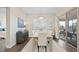 Bright dining space with modern furnishings, hardwood floors, and access to an outdoor patio at 2116 Limestone Trl, Kissimmee, FL 34747