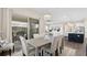 Inviting dining area with stylish lighting and furniture, flowing seamlessly to the outdoor patio at 2116 Limestone Trl, Kissimmee, FL 34747