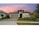 Charming single-story home with a well-manicured lawn and a welcoming two-car garage at 2116 Limestone Trl, Kissimmee, FL 34747