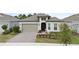 Charming single-Gathering home boasts a well-manicured front yard and a welcoming two-car garage at 2116 Limestone Trl, Kissimmee, FL 34747