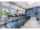 Modern gym with treadmills and ellipticals, offering a bright and motivating workout environment at 2116 Limestone Trl, Kissimmee, FL 34747