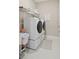 Well-equipped laundry room with modern, front-loading appliances and ample storage space at 2116 Limestone Trl, Kissimmee, FL 34747