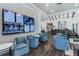 Inviting community lounge area featuring cozy armchairs, large screen TVs, and a bar area at 2116 Limestone Trl, Kissimmee, FL 34747
