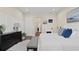 Bedroom featuring wood floors, a fireplace, and a view into the hallway at 2116 Limestone Trl, Kissimmee, FL 34747