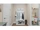 Mudroom with coat rack and built in storage and adjacent laundry area at 2116 Limestone Trl, Kissimmee, FL 34747