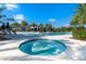 Inviting jacuzzi with crystal clear water, complemented by a large pool and lush tropical landscaping at 2116 Limestone Trl, Kissimmee, FL 34747