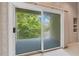 Balcony overlooking lush greenery with a partial view of the sky at 2504 Gatlin Ave, Orlando, FL 32806