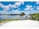 Expansive rooftop balcony with beautiful lake view and white metal railing at 2504 Gatlin Ave, Orlando, FL 32806