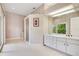 Spacious bathroom with shower, vanity, ample lighting, and a picturesque view from the window at 2504 Gatlin Ave, Orlando, FL 32806