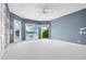 Spacious bedroom with lake views, a ceiling fan, and balcony access at 2504 Gatlin Ave, Orlando, FL 32806