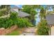 View of a covered boat house on a canal with lush greenery at 2504 Gatlin Ave, Orlando, FL 32806