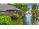 Waterfront boathouse with a covered slip provides direct access to the lake at 2504 Gatlin Ave, Orlando, FL 32806