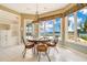 Bright breakfast nook with lake views and tile flooring at 2504 Gatlin Ave, Orlando, FL 32806