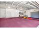 Spacious garage with work bench, storage cabinets, room for kayak and bike storage at 2504 Gatlin Ave, Orlando, FL 32806